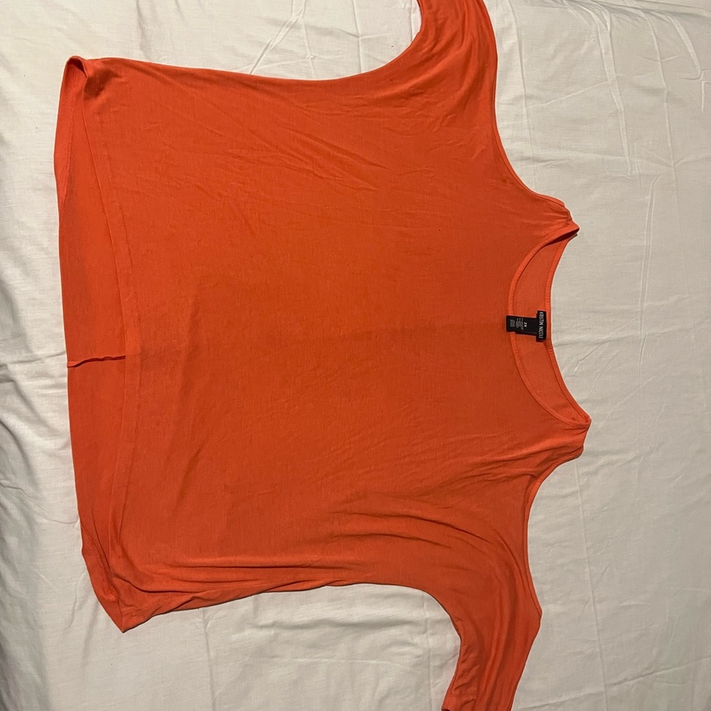 Kristin Nicole peach top with long sleeves, shoulders out.